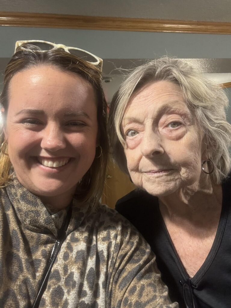 Cat with Tranquil Transition Partners smiles with a senior homeowner who is relieved to have her home that was in disrepair sold , and that she is able to use her equity to fund her new home in Venice, Florida.