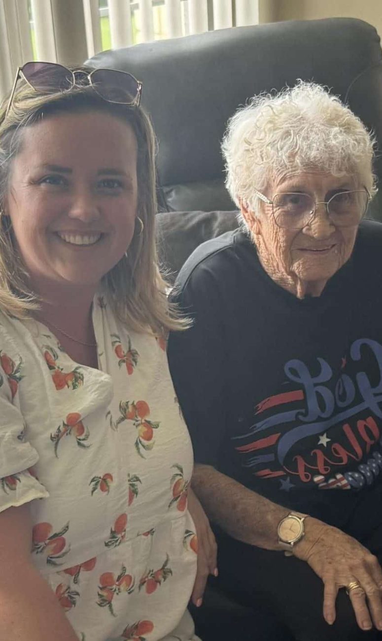 Cat with Tranquil Transition Partners in Venice Florida sits with a happy client who just sold her home to fund her move to her new Senior Living community.